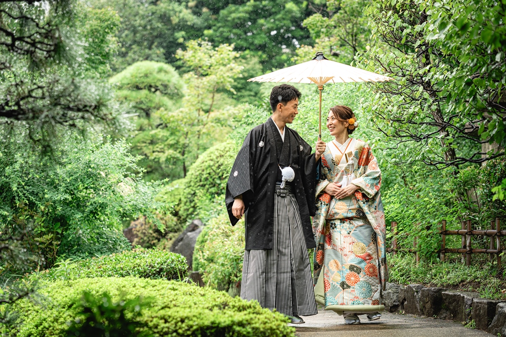 A traditional Japanese wedding photo shoot with a focus on elegant attire.