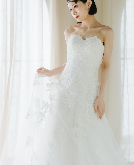 Slender A-line style wedding dress (OR07): A delicate lace train adds elegance to the back, worn for a pre-wedding photoshoot in Japan.