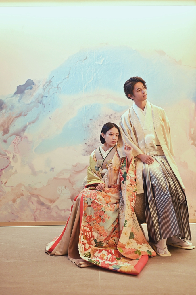 A bride framed by blue art