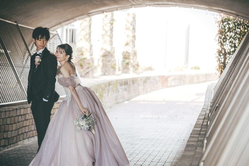 Bride in a sleek minimalist wedding dress photographed in the elegant Omotesando area of Tokyo