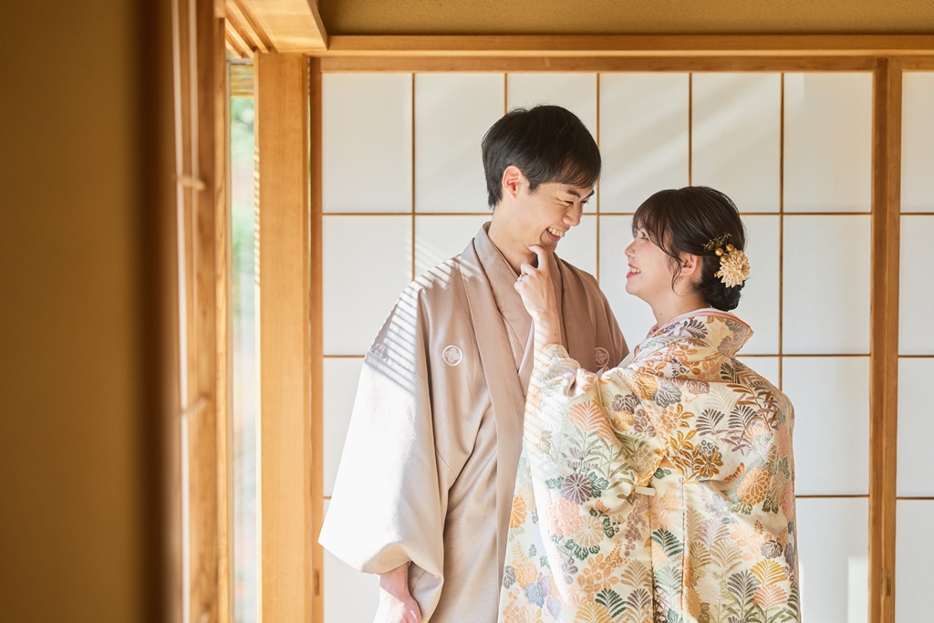 Bride and groom preparing for their pre-wedding photo shoot, reviewing outfits and planning