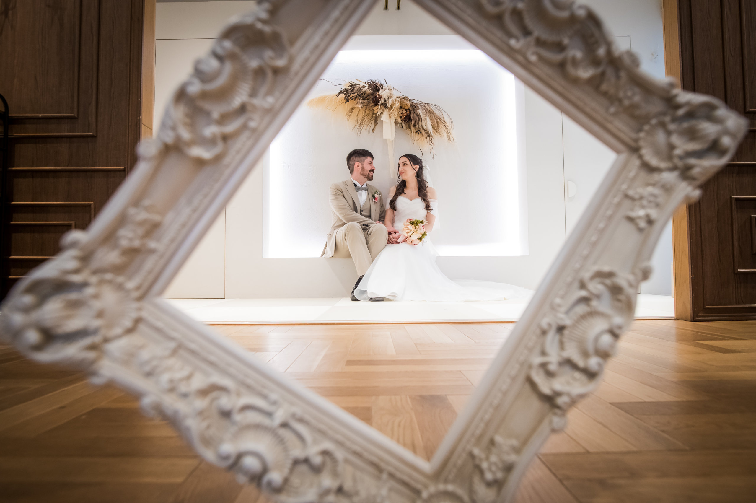 Couple smiling as they receive their finished photo data online