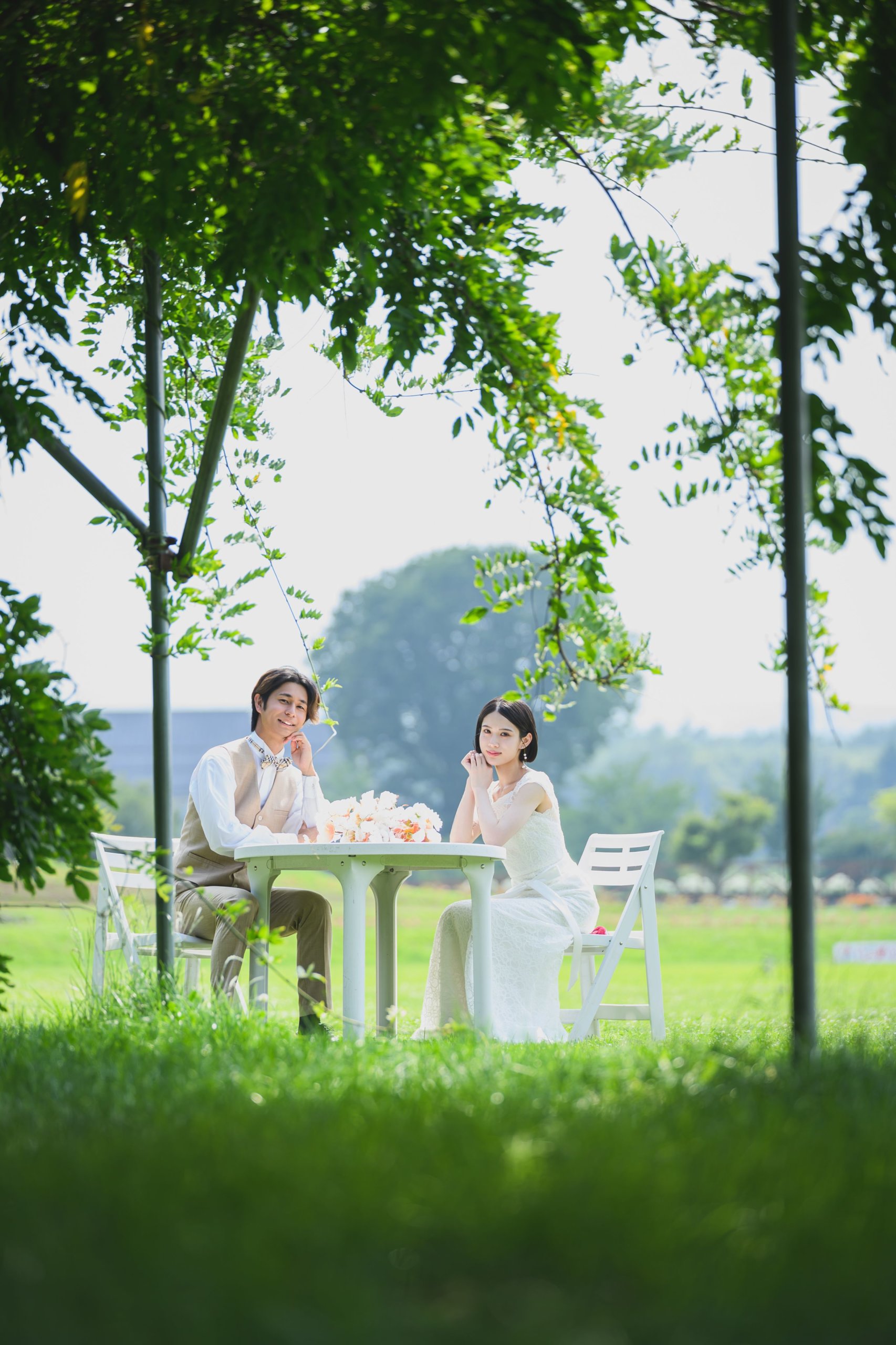 Photographer and couple sharing a natural moment during a location shoot