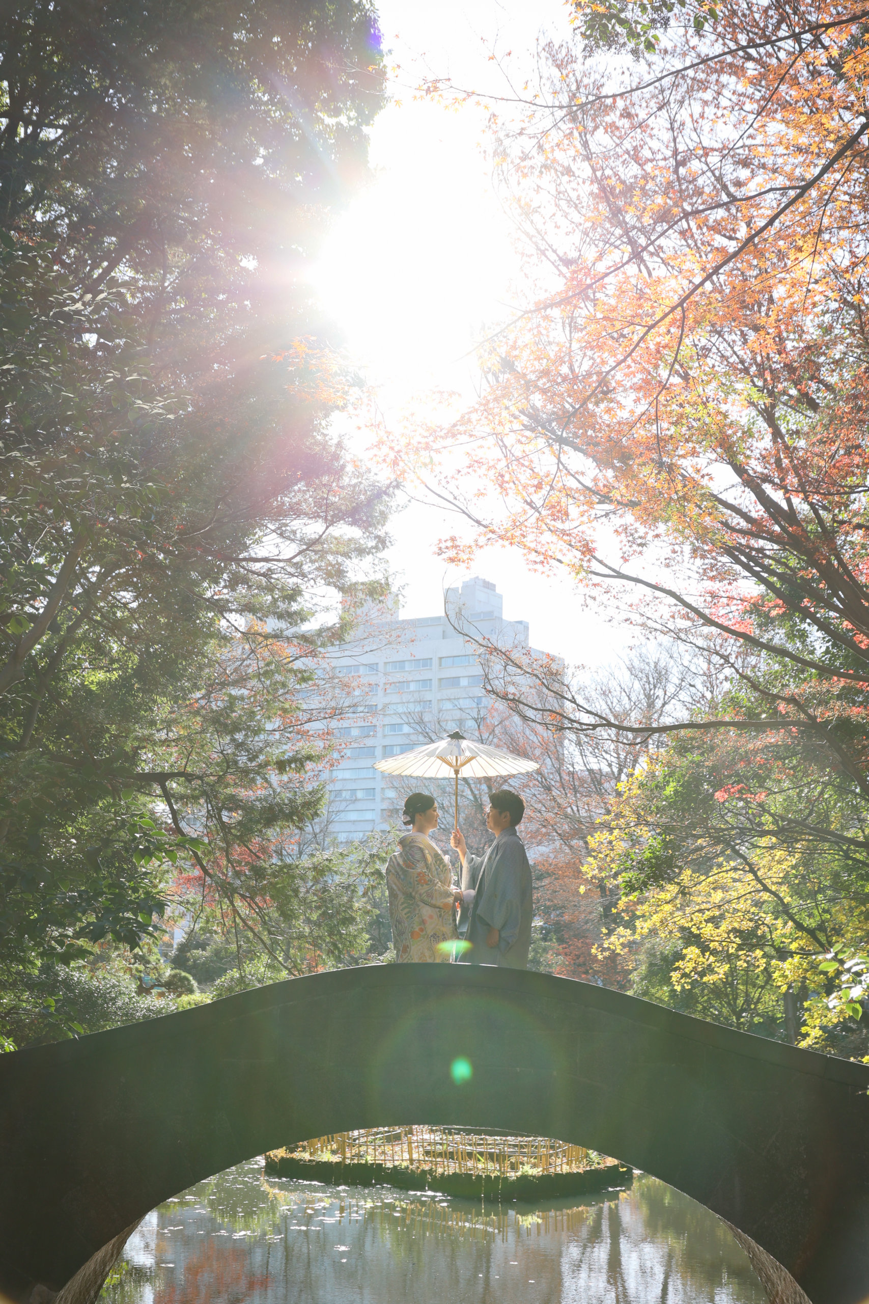 Arisugawa Memorial Park stone arch bridge — a substantial arched stone bridge in a woodland setting, one of the most distinctive wedding photography spots in central Tokyo