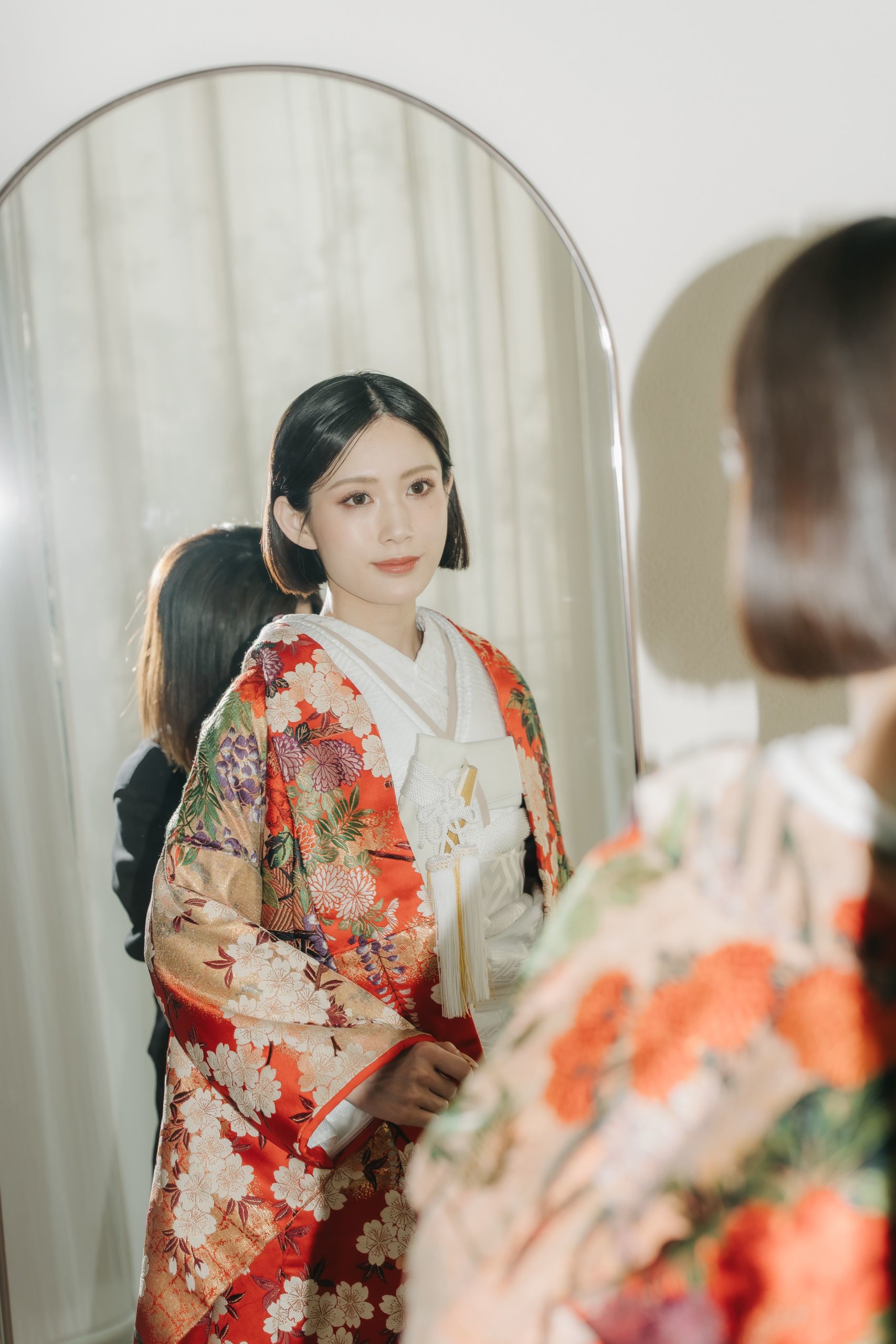 Trying on a dress or kimono and checking the mirror