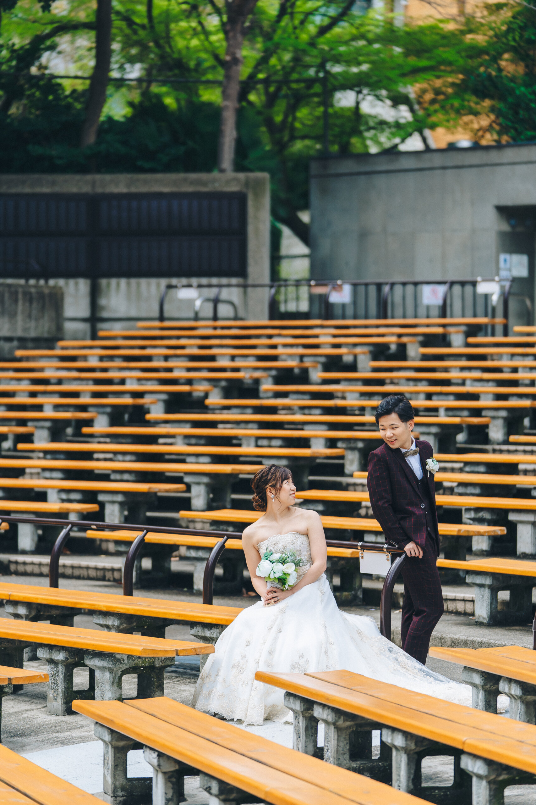 Dress selection for Hibiya Park — lace and full-skirt dresses suit the classical fountain, while simple lines complement the outdoor concert hall's strong architecture