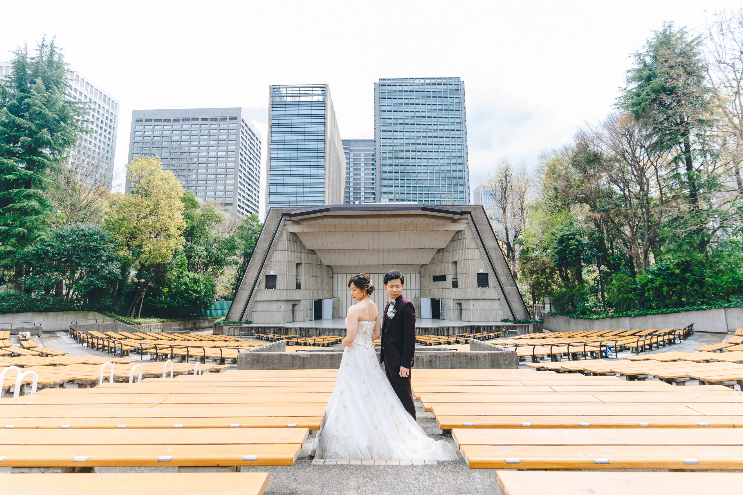Hibiya Outdoor Concert Hall wedding photography — the arched stage structure provides an architectural frame unlike anything else in Tokyo's parks