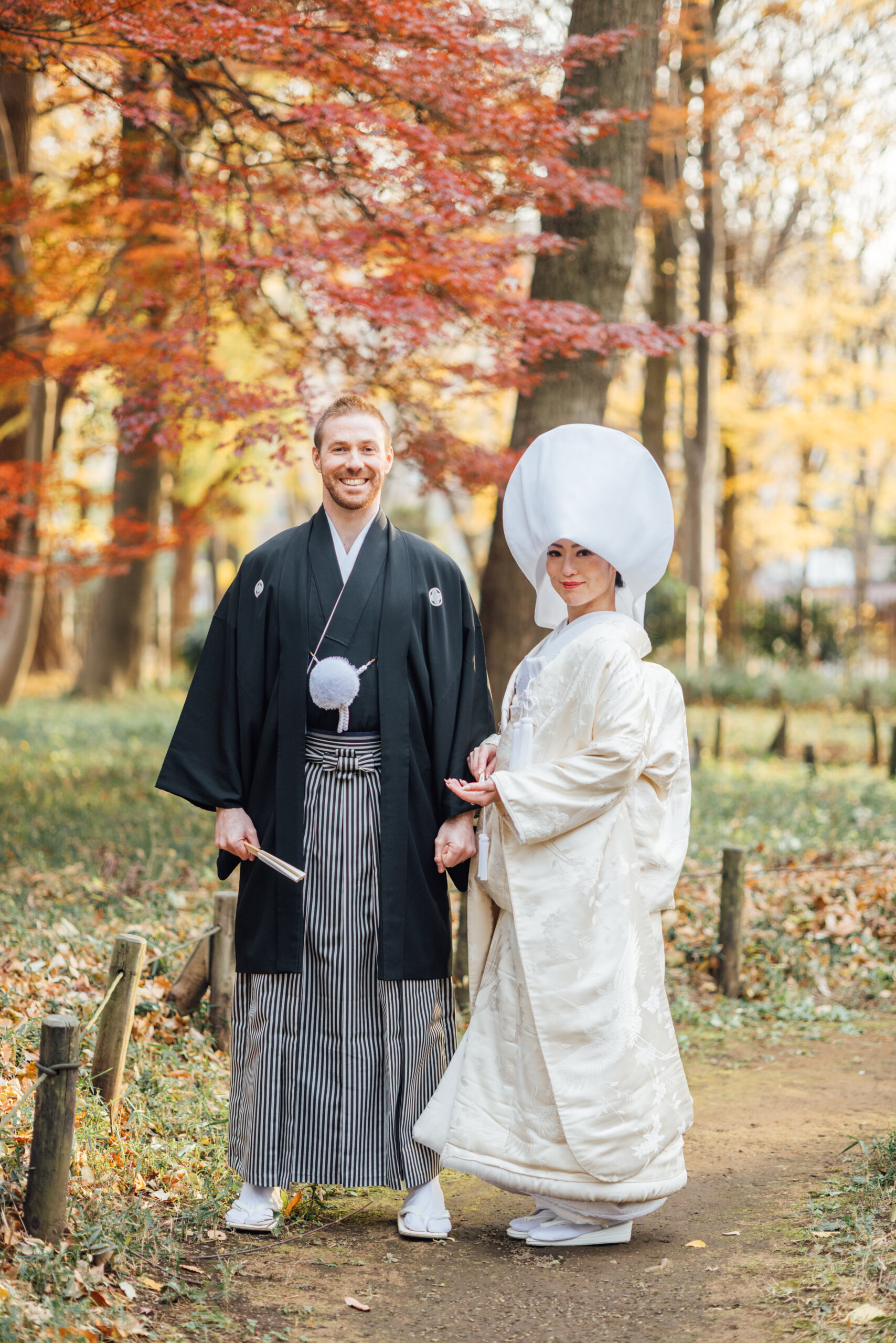 Roka Koushun Garden seasonal beauty — fresh summer green or autumn foliage surrounds the historic farmhouse and bamboo grove, adding seasonal depth to the photography