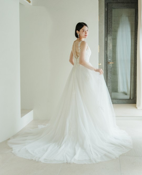 Back view of a White One A-line wedding dress with sheer lace back and covered buttons (DS01), Japan wedding photography at our Tokyo Omotesando studio.