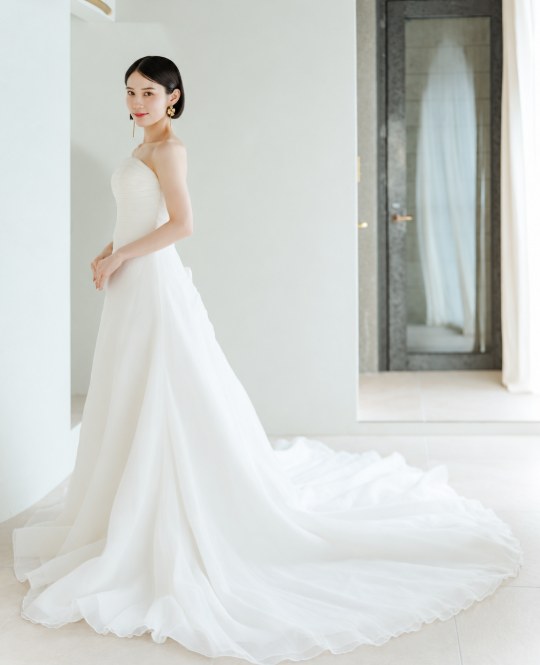 Bride in a White One strapless organza A-line wedding dress with a long flowing train (DS04), pre-wedding photoshoot in Japan at our Tokyo Omotesando studio.