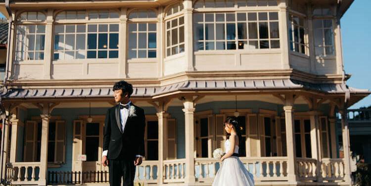 Standing before the elegant colonial-style facade of Rokkaen, a beautifully preserved Western mansion in Kuwana and a popular Japan wedding photography location.